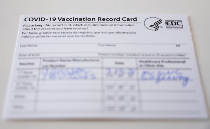 A COVID-19 vaccination record card issued by the Centers for Disease Control is seen in this undated file photo. (Photo By Bi