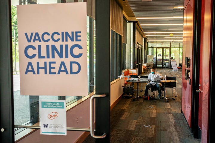 A pharmacist waits for patients at a COVID-19 vaccination clinic on the University of Washington campus on May 18, 2021 in Se