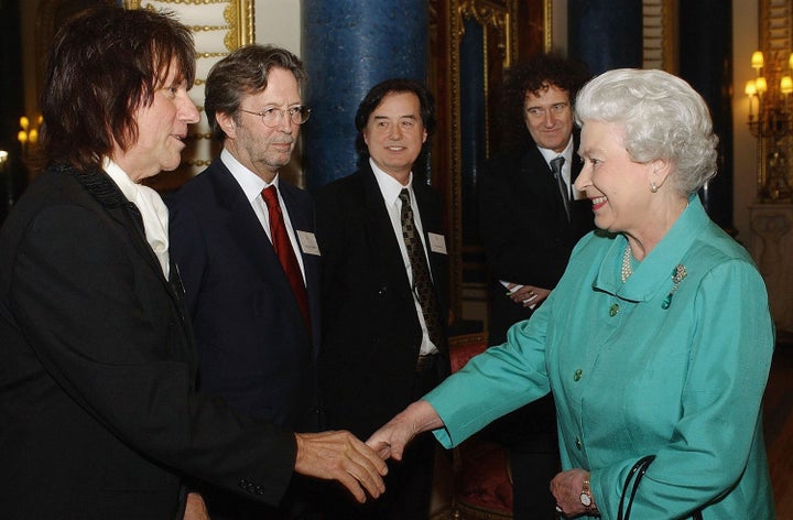 Musicians (from left) Jeff Beck, Eric Clapton, Jimmy Page and Brian May greet Queen Elizabeth II in 2005.