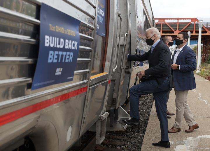President Joe Biden boards an Amtrak train in Cleveland.