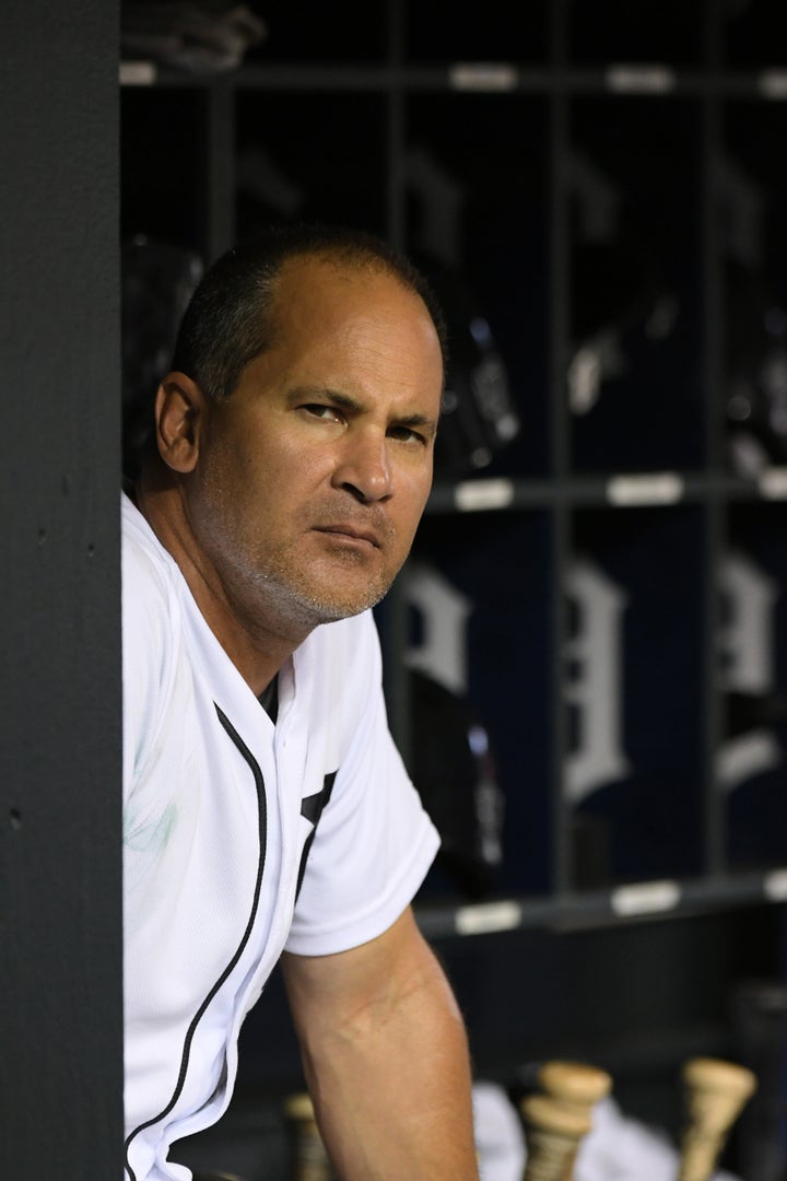 DETROIT, MI - SEPTEMBER 22: First base coach Omar Vizquel #13 of the Detroit Tigers looks on from the dugout during the game