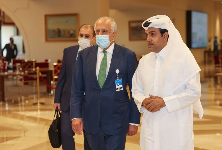 US special envoy for Afghanistan Zalmay Khalilzad, center, and Qatar's envoy on counter-terrorism Mutlaq al-Qahtani, right, w