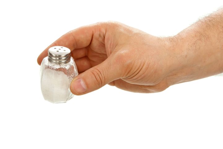 hand holding salt cellar...