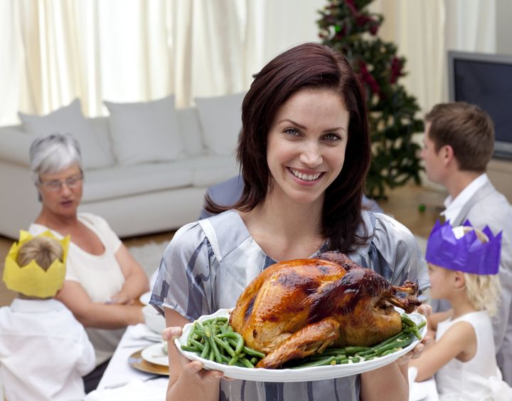 woman showing christmas turkey...