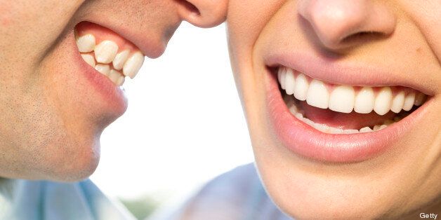 extreme close up of mouths only, beautiful couple smiling