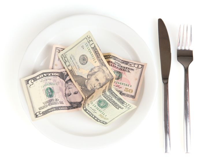 money on plate isolated on...