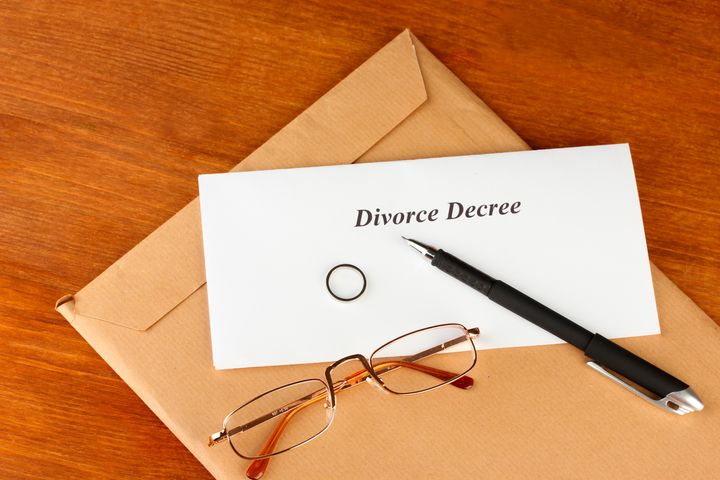 divorce decree and envelope on...