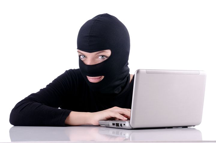 hacker with computer wearing...