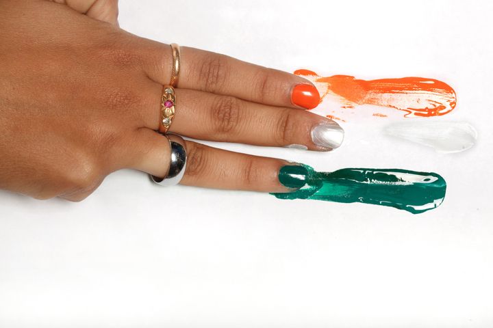 Close up of hand with tri colour paint