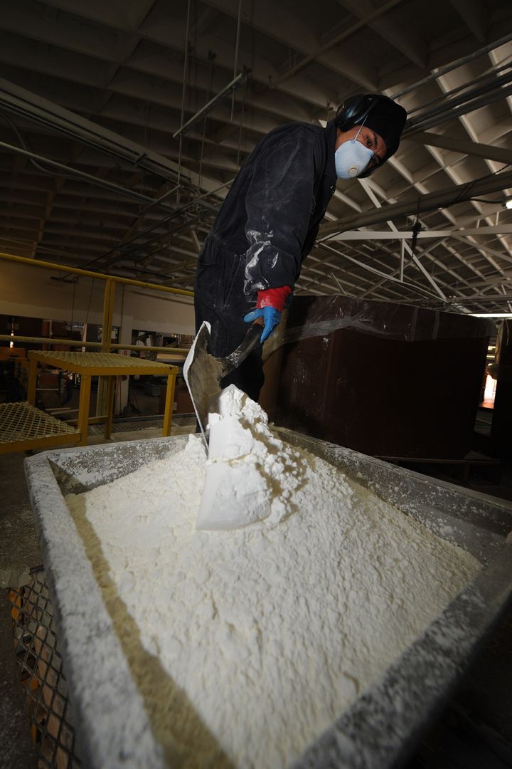 A worker from the plastics manufacturer Cereplast, prepares plastic resin products at their factory complex in Los Angeles on December 15, 2009. Cereplast produce a range of environmentally-neutral plastics which contain no BPA's, suspected of being hazardous to humans since the 1930s, concerns about the use of bisphenol A in consumer products were regularly reported in the news media in 2008 after several governments issued reports questioning its safety, and some retailers have removed products made of it from their shelves. AFP PHOTO/Mark RALSTON (Photo credit should read MARK RALSTON/AFP/Getty Images)