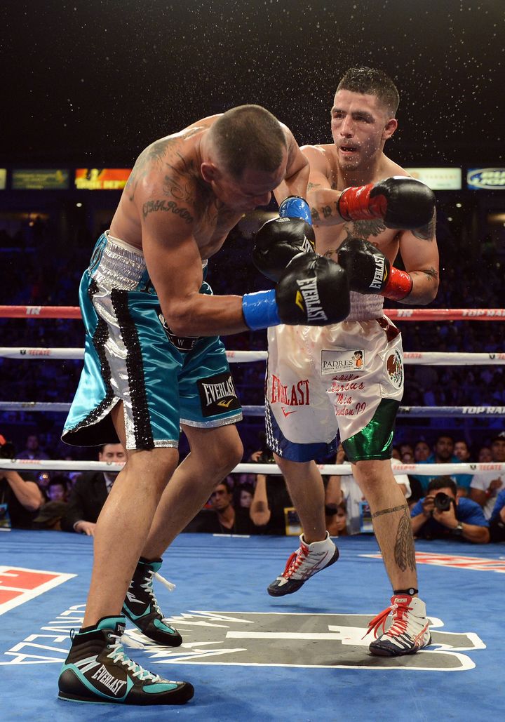 CARSON, CA - OCTOBER 13: Brandon Rios punches Mike Alvarado on his way to a seventh round TKO win during the WBO Latino Super Lightweight Title fight at The Home Depot Center on October 13, 2012 in Carson, California. (Photo by Harry How/Getty Images)