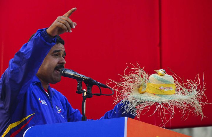 Venezuela's acting President and presidential candidate Nicolas Maduro delivers a speech during a campaign rally in Catia la Mar, state of Vargas on April 9, 2013. Venezuelans will elect new president next April 14 and the final stretch of Venezuela's race to replace Hugo Chavez coincides with a delicate anniversary for the opposition: 11 years since a brief coup against the late leftist leader. AFP PHOTO/Luis Acosta (Photo credit should read LUIS ACOSTA/AFP/Getty Images)