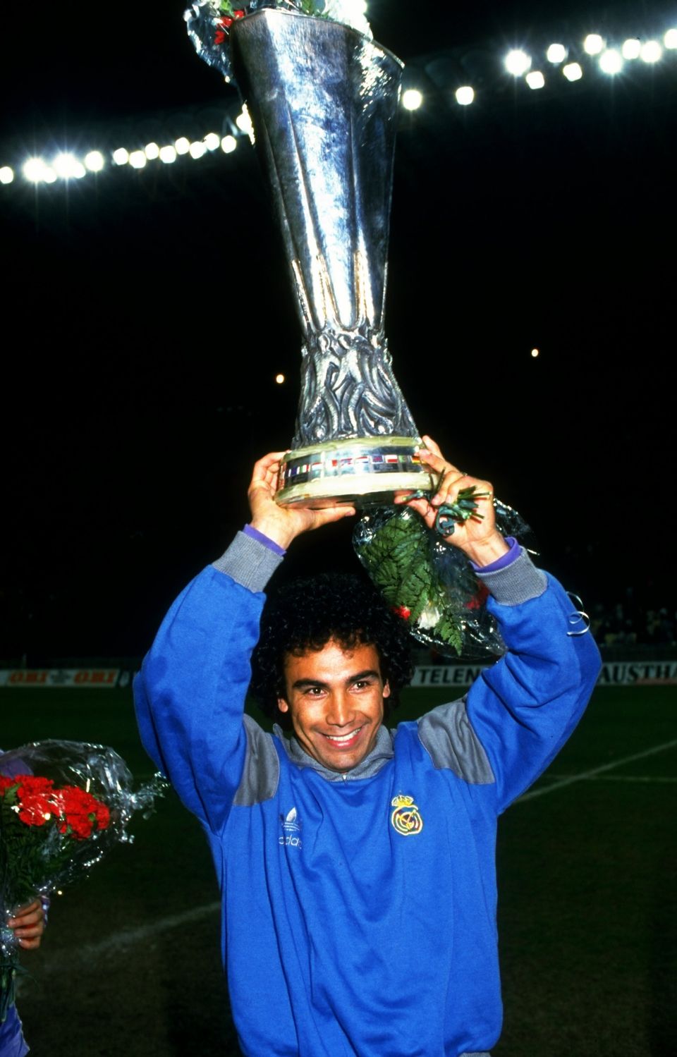 Hugo Sanchez of Real Madrid celebrates with the trophy aloft after winning the UEFA Cup Final