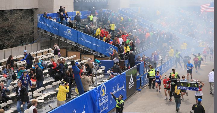 BOSTON - APRIL 15: Police clear the bleachers after two explosions went off near the finish line of the 117th Boston Marathon on April 15, 2013. (Photo by David L. Ryan/The Boston Globe via Getty Images)