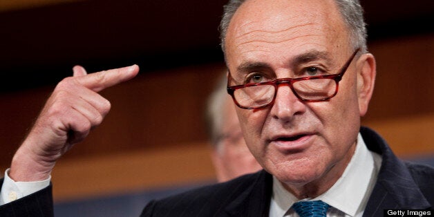 UNITED STATES ? AUGUST 3: Sen. Charles Schumer, D-N.Y., points his hand like a gun as he describes the FAA reauthorization bill being held hostage by House Republicans during a news conference on the Federal Aviation Administration on Wednesday, Aug. 3, 2011. Hoyer is holding a copy of H.R. 2644, the Aviation Jobs and Safety Act of 2011. (Photo By Bill Clark/Roll Call)