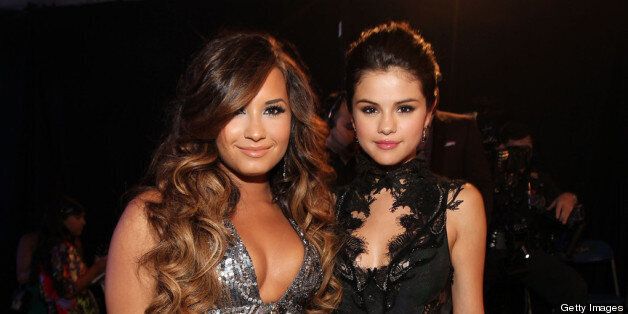 LOS ANGELES, CA - AUGUST 28: Singer/actresses Demi Lovato (L) and Selena Gomez arrive at the 2011 MTV Video Music Awards at Nokia Theatre L.A. LIVE on August 28, 2011 in Los Angeles, California. (Photo by Christopher Polk/Getty Images)