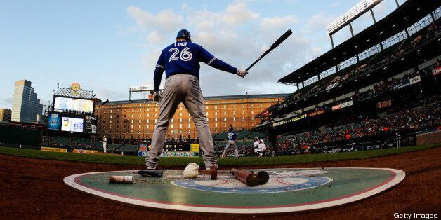 BALTIMORE, MD - APRIL 22: Adam Lind #26 of the Toronto Blue Jays waits to bat against the Baltimore Orioles during the second inning at Oriole Park at Camden Yards on April 22, 2013 in Baltimore, Maryland. (Photo by Rob Carr/Getty Images)