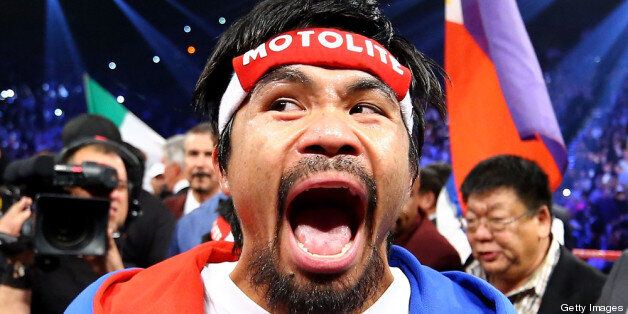LAS VEGAS, NV - DECEMBER 08: Manny Pacquiao screams in the ring before taking on Juan Manuel Marquez during their welterweight bout at the MGM Grand Garden Arena on December 8, 2012 in Las Vegas, Nevada. (Photo by Al Bello/Getty Images)