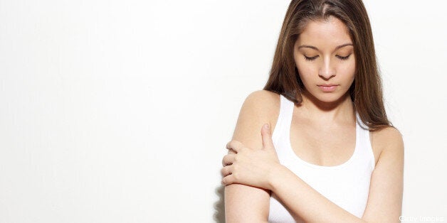 Middle Eastern woman with arms crossed