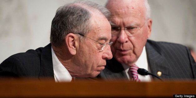 UNITED STATES - APRIL 23: Sen. Chuck Grassley, R-Iowa; and Chairman Patrick Leahy, D-Vt., at a Senate Judiciary Committee hearing on ?The Border Security, Economic Opportunity, and Immigration Modernization Act, S.744? (Photo by Chris Maddaloni/CQ Roll Call)