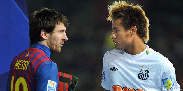 Strikers, Lionel Messi (L) of Barcelona and Neymar (R) of Santos speak to each other during the awarding ceremony after the final football match against Santos at the FIFA Club World Cup in Yokohama on December 18, 2011. Barcelona won the match 4-0 . AFP PHOTO/KAZUHIRO NOGI (Photo credit should read KAZUHIRO NOGI/AFP/Getty Images)