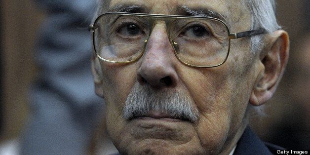 Former Argentina's dictator and General Jorge Rafael Videla gestures at the courtroom before receiving the sentence for his responsibility in an orchestrated plan to kidnap children from people disappeared during the military dictatorship (1976-83) in Buenos Aires on July 5, 2012. AFP PHOTO / Juan Mabromata (Photo credit should read JUAN MABROMATA/AFP/GettyImages)