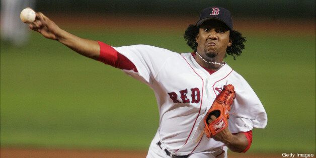 UNITED STATES - SEPTEMBER 24: Boston Red Sox's starter Pedro Martinez hurls a pitch against the New York Yankees during game at Fenway Park. The Red Sox were ahead, 4-3, until Martinez allowed two runs in the eighth; he was taken out and the Yanks went on to win the first game of a three-game series, 6-4. (Photo by Keith Torrie/NY Daily News Archive via Getty Images)