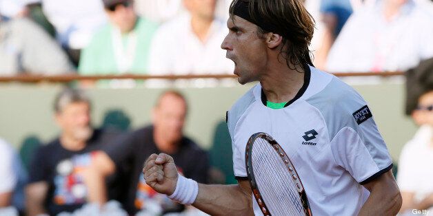 Spain's David Ferrer reacts after winning a point against France's Jo-Wilfried Tsonga during their French tennis Open semi-final match at the Roland Garros stadium in Paris on June 7, 2013. AFP PHOTO / PATRICK KOVARIK (Photo credit should read PATRICK KOVARIK/AFP/Getty Images)
