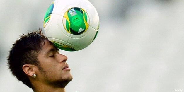 Brazil's forward Neymar takes part in a training session in Fortaleza, northeastern Brazil, on the eve of their FIFA Confederations Cup Brazil 2013 Group A football match against Mexico, on June 18, 2013. AFP PHOTO / YURI CORTEZ (Photo credit should read YURI CORTEZ/AFP/Getty Images)