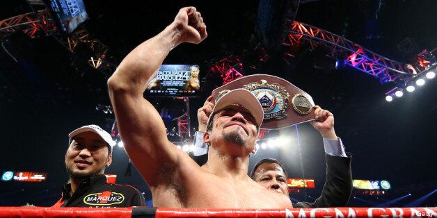 LAS VEGAS, NV - DECEMBER 08: Juan Manuel Marquez celebrates after defeating Manny Pacquiao by a sixth round knockout in their welterweight bout at the MGM Grand Garden Arena on December 8, 2012 in Las Vegas, Nevada. (Photo by Al Bello/Getty Images)