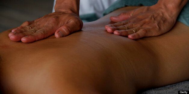 Hands on a woman body for massage