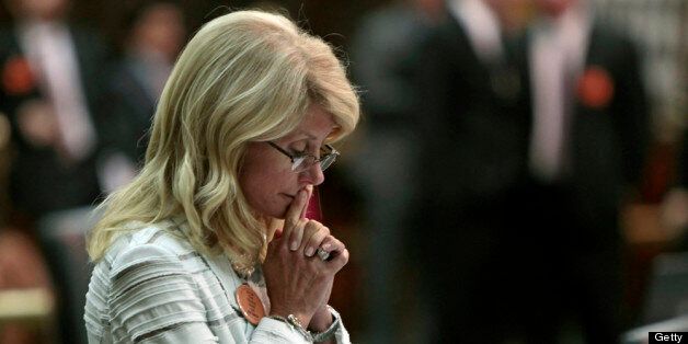 AUSTIN, TX - JUNE 25: State Sen. Wendy Davis (D-Ft. Worth) contemplates her 13-hour filibuster after the Democrats defeated the anti-abortion bill SB5, which was up for a vote on the last day of the legislative special session June 25, 2013 in Austin, Texas. A combination of Sen. Davis' filibuster and protests by reproductive rights advocates helped to ultimately defeat the controversial abortion legislation at midnight. (Photo by Erich Schlegel/Getty Images)