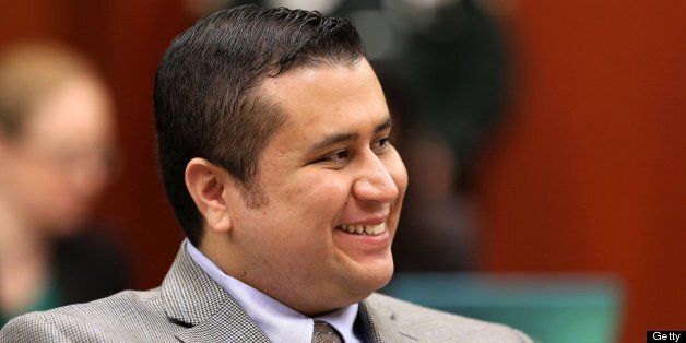 George Zimmerman smiles in response to a juror's answer during voir dire questioning in Seminole circuit court on the eighth day of his trial, in Sanford, Florida, Wednesday, June 19, 2013. Zimmerman is accused in the fatal shooting of Trayvon Martin. (Joe Burbank/Orlando Sentinel/MCT via Getty Images)