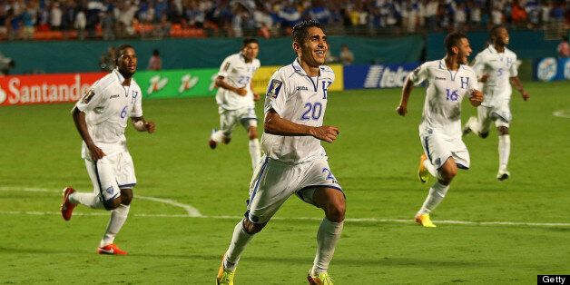 MIAMI GARDENS, FL - JULY 12: Jorge Claros Juarez #20 of Honduras celebrates an extra time goal during a CONCACAF Gold Cup game against EL Salvador at Sun Life Stadium on July 12, 2013 in Miami Gardens, Florida. (Photo by Mike Ehrmann/Getty Images)