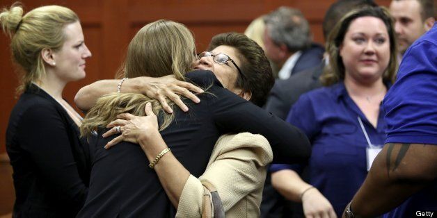 George Zimmerman's family celebrates after the jury found Zimmerman not guilty in Seminole circuit court in Sanford, Florida, Saturday, July 13, 2013. Zimmerman had been charged with second-degree murder for the 2012 shooting death of Trayvon Martin. (Gary W. Green/Orlando Sentinel/MCT via Getty Images)