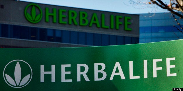 Herbalife Ltd. signage is displayed outside of the company's corporate headquarters in Torrance, California, U.S., on Thursday, Jan. 10, 2013. Daniel Loeb is squaring off against Bill Ackman over the future of Herbalife Ltd. By taking an 8.2 percent stake in the direct seller of nutrition shakes, Loeb?s Third Point LLC is the latest firm to reject hedge fund manager Ackman?s theory that Herbalife is a pyramid scheme. Photographer: Patrick Fallon/Bloomberg via Getty Images