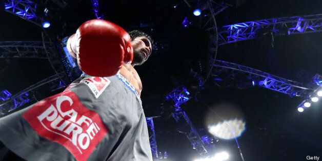 LAS VEGAS, NV - DECEMBER 08: Manny Pacquiao in the ring while taking on Juan Manuel Marquez during their welterweight bout at the MGM Grand Garden Arena on December 8, 2012 in Las Vegas, Nevada. (Photo by Al Bello/Getty Images)