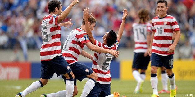 BALTIMORE, MD - JULY 21: Joe Corona #6 of the United States celebrates with his teammates after scoring a goal in the first half against El Salvador during the 2013 CONCACAF Gold Cup quarterfinal game at M&T Bank Stadium on July 21, 2013 in Baltimore, Maryland. (Photo by Patrick McDermott/Getty Images)