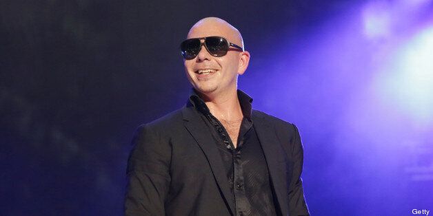 MIAMI BEACH, FL - JUNE 29: Pitbull performs at the iHeartRadio Ultimate Pool Party Presented By VISIT FLORIDA at Fontainebleau Miami Beach on June 29, 2013 in Miami Beach, Florida. (Photo by Alexander Tamargo/WireImage)