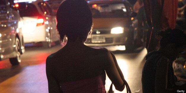 BANGKOK, THAILAND - JUNE 26: A Thai prostitute waits for clients at the side of the road in the street of Soi Nana on Sukhumvit road, a notorious hang out for prostitution targeting foreign customers, on June 26, 2011 in Bangkok, Thailand.(Photo by Olivier CHOUCHANA/Gamma-Rapho via Getty Images)