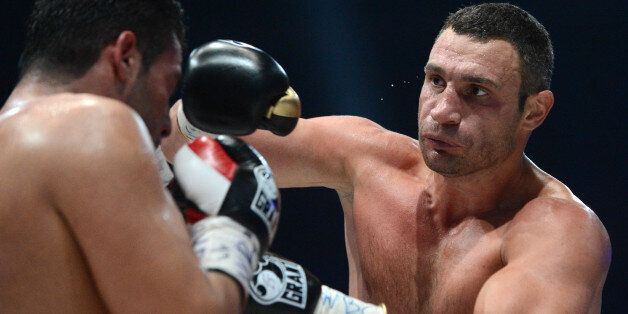 Ukraine's two-time World Heavyweight champion Vitali Klitschko (R) fights for the defense of his WBC heavyweight title against Germany's Manuel Charr in Moscow early on September 9, 2012. AFP PHOTO / KIRILL KUDRYAVTSEV (Photo credit should read KIRILL KUDRYAVTSEV/AFP/GettyImages)