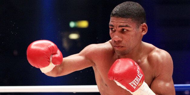 HAMBURG, GERMANY - MARCH 27: Yuriorkis Gamboa of Cuba in action against Jonathan Barros of Argentina during the featherweight WBA championship fight during the ran boxen knockout Night of Champions at the Alsterdorfer Sporthalle on March 27, 2010 in Hamburg, Germany. (Photo by Martin Rose/Bongarts/Getty Images)