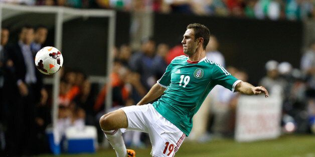 ATLANTA, GA - JULY 20: Miguel Layun #19 of Mexico attempts to trap the ball during the CONCACAF Gold Cup quarterfinal game against Trinidad & Tobago at the Georgia Dome on July 20, 2013 in Atlanta, Georgia. (Photo by Mike Zarrilli/Getty Images)