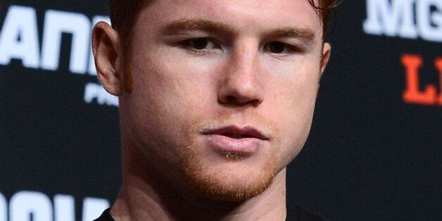 LAS VEGAS, NV - SEPTEMBER 11: Boxer Canelo Alvarez arrives at the final news conference for his fight with Floyd Mayweather Jr. at the MGM Grand Hotel/Casino on September 11, 2013 in Las Vegas, Nevada. Alvarez and Mayweather will meet in a WBC/WBA 154-pound title fight on September 14 in Las Vegas. (Photo by Ethan Miller/Getty Images)