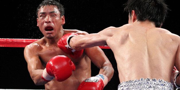 LAS VEGAS, NV - OCTOBER 01: (R-L) Toshiaki Nishioka and Rafael Marquez exchange blows during their WBC super bantamweight title fight at the Marquee Ballroom in the MGM Grand Conference Center October 1, 2011 in Las Vegas, Nevada. (Photo by Jeff Bottari/Getty Images)