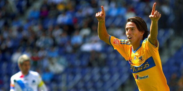 PUEBLA, MEXICO - JANUARY 17 : Tigres' player Lucas Lobos celebrates his goal against Puebla during their match as part of the 2010 Bicentenary Tournament in the Mexican Football League at the Cuauhtemoc Stadium on January 18, 2010 in Puebla, Mexico (Photo by Jaime Lopez/Jam Media/LatinContent/Getty Images)