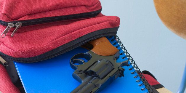Backpack, notebooks, and handgun