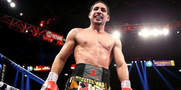 LAS VEGAS, NV - SEPTEMBER 14: Danny Garcia celebrates after the 12th round against Lucas Matthysse in their WBC/WBA super lightweight title fight at the MGM Grand Garden Arena on September 14, 2013 in Las Vegas, Nevada. (Photo by Al Bello/Getty Images)