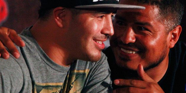 SHANGHAI, CHINA - JULY 31: Brandon Rios (L) and his coach Robert Garcia chat at a press conference on July 31, 2013 in Shanghai, China. (Photo by Kevin Lee/Getty Images)