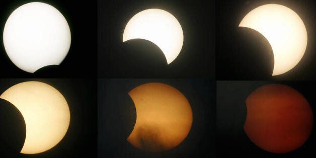 LIMA, PERU: Six-picture combo of a rare type of eclipse called 'hybrid eclipse' which occurs because of the curvature of the Earth, seen 08 Abril 2005, in Lima, Peru. AFP PHOTO/JAIME RAZURI (Photo credit should read JAIME RAZURI/AFP/Getty Images)